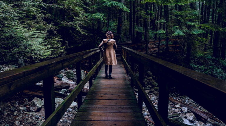 Indira on a bridge in the forest of Lynn Valley in North Vancouver